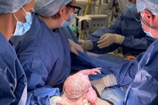 A baby boy named Hugo Powell has become the first child born in Britain to a mother who received a womb transplanted from a deceased donor, a breakthrough announced February 24, 2026, that offers new hope to women born without a viable uterus.