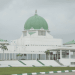 National Assembly in Nigeria with green dome and modern architecture.