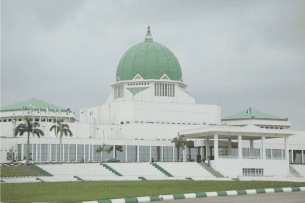 National Assembly in Nigeria with green dome and modern architecture.