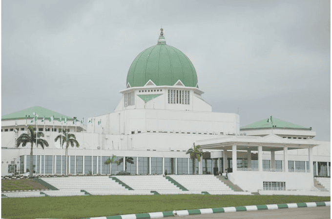 National Assembly in Nigeria with green dome and modern architecture.